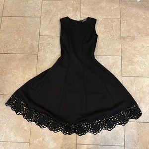 Donna Rico size 2 black dress with embroidered hemline